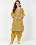 Mustard kurta and dhoti-style trouser set with geometric embroidery.