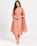 Peach kurta with an embroidered neckline and scattered floral motifs, paired with matching straight trousers and a dupatta.