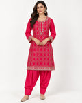 Pink kurta and dhoti-style trouser set with geometric embroidery.