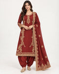 Rust embroidered kurta with Patiala-style trousers and matching embroidered dupatta.